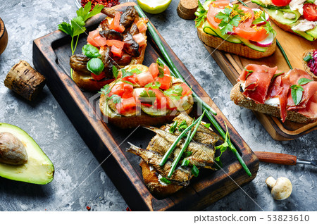 Bruschetta with various toppings Bruschetta with various toppings 53823610