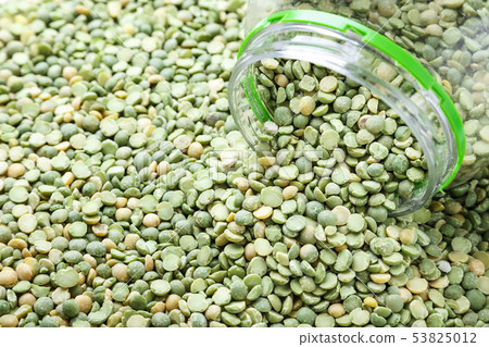 dry green peas scattered as a background. 53825012