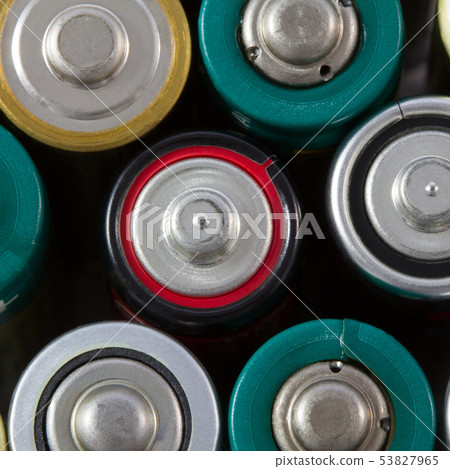 Close-up top view of alkaline AA batteries. 53827965