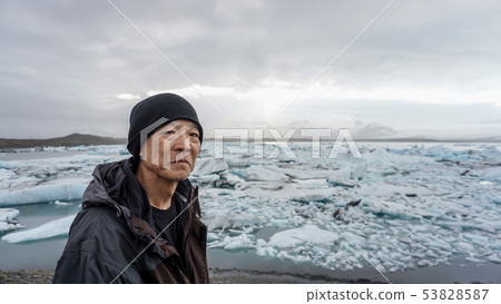 Asian senior man with Iceland glacier amazing 53828587
