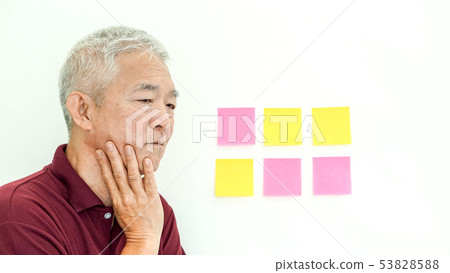 Asian senior man expression worry note paper. copy 53828588
