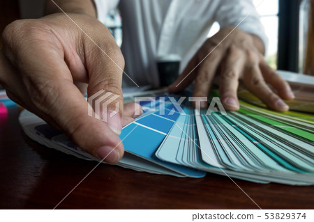 Graphic designer choose color band sample. 53829374
