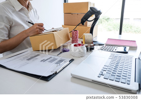 Young entrepreneur SME receive order client and Young entrepreneur SME receive order client and 53830308