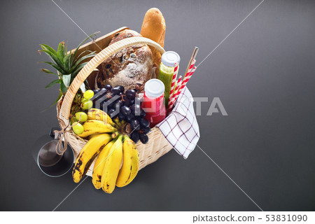 Basket filled food fruits drinks picnic summer 53831090