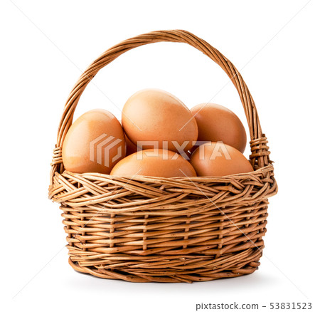Basket with chicken eggs closeup on a white Basket with chicken eggs closeup on a white 53831523