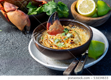 CHILEAN FOOD. Baked crabmeat crab meat with cheese, cream and bread. Traditional dish of chilean CHILEAN FOOD. Baked crabmeat crab meat with cheese, cream and bread. Traditional dish of chilean 53834633