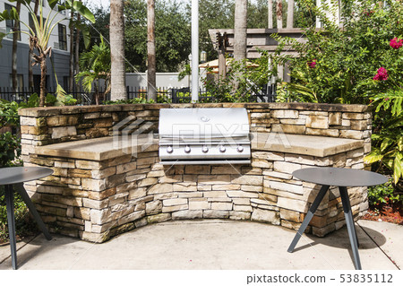 Gas barbecue grill in garden at hotel in Florida Gas barbecue grill in garden at hotel in Florida 53835112