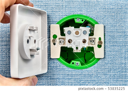 Electrical wall outlet in disassembled state. Electrical wall outlet in disassembled state. 53835225