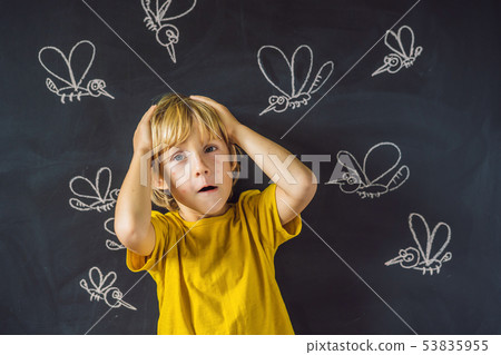 The boy is bitten by mosquitoes on a dark background. On the blackboard with chalk painted The boy is bitten by mosquitoes on a dark background. On the blackboard with chalk painted 53835955