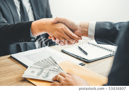 Corruption concept,Business man passing money 53838807