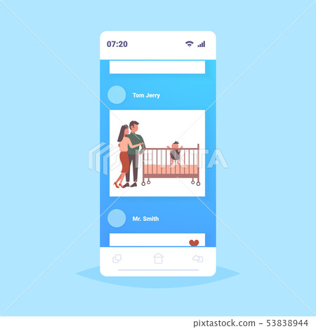 father mother and their newborn baby in crib having fun together happy family parenthood concept man 53838944