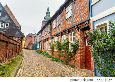 Street with Medieval old brick buildings. Street with Medieval old brick buildings. 53841036
