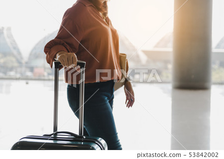 Young asian traveler women and luggage at airport 53842002