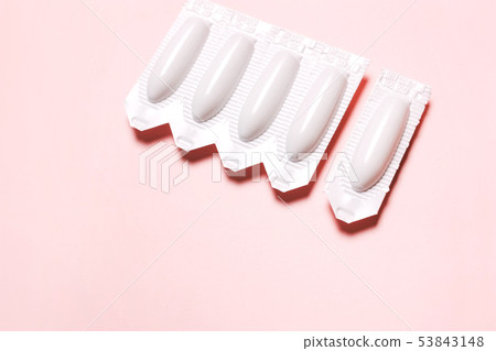suppository on a pink background, for the 53843148