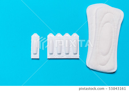 Medical, vaginal suppositories on a blue Medical, vaginal suppositories on a blue 53843161
