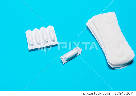 Medical, vaginal suppositories on a blue Medical, vaginal suppositories on a blue 53843167