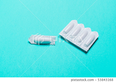 suppository on a blue background, for the 53843168