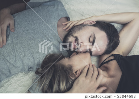 Loving happy couple in love smile and kiss her 53844698