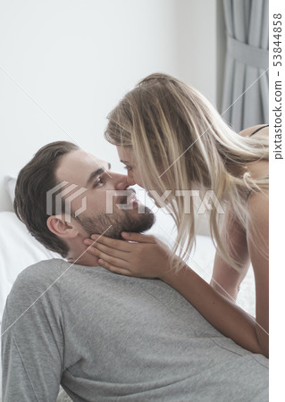 Loving happy couple in love smile kissing and hug Loving happy couple in love smile kissing and hug 53844858