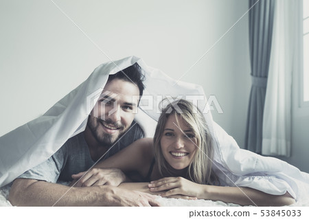 Loving happy couple in love smile and kiss each 53845033