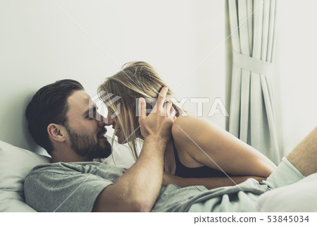 Loving happy couple in love smile kissing and hug Loving happy couple in love smile kissing and hug 53845034