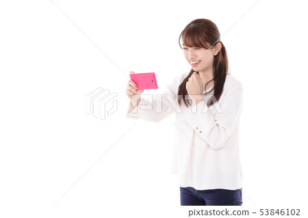 A young lady shooting 53846102