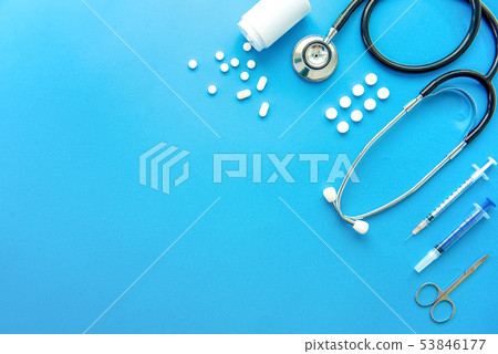 Pills and medical equiupments on blue background Pills and medical equiupments on blue background 53846177