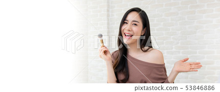 Beautiful beauty blogger doing make up tutorial 53846886