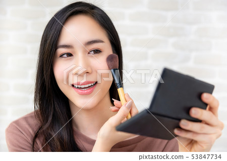Asian beauty blogger doing cosmetic makeup tutor Asian beauty blogger doing cosmetic makeup tutor 53847734