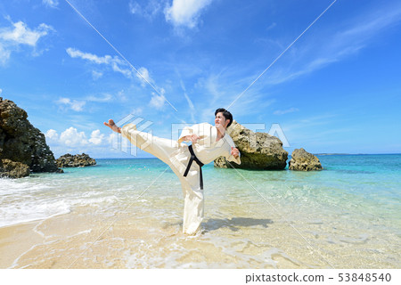 Men training on a beautiful tropical country beach Men training on a beautiful tropical country beach 53848540