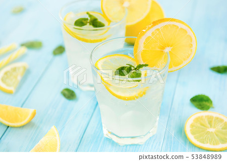 Sweet and sour lemonade juice with ice cubes Sweet and sour lemonade juice with ice cubes 53848989