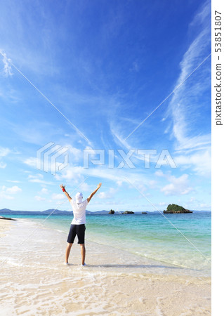 Men relaxing on the beautiful beaches of Okinawa 53851807