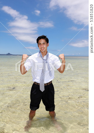 A beautiful tropical beach and a smiling man 53851820