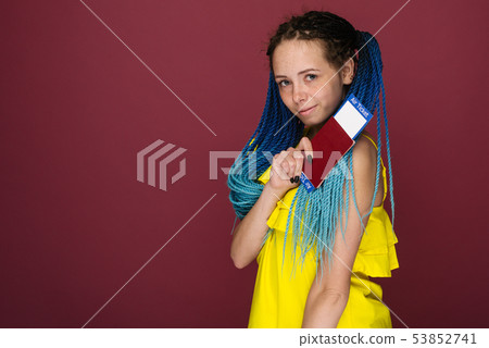 A modern trendy smiling woman in yellow dress with 53852741