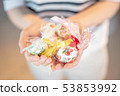 A scene from women giving gifts 53853992