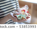 A scene from women giving gifts 53853993
