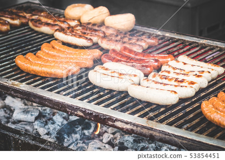 suasages on barbecue grill - grilling sausage   53854451