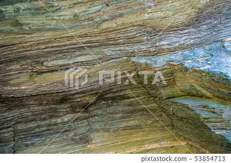 Banded rock like an annual ring Banded rock like an annual ring 53854713