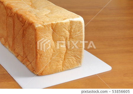 Square shaped bread before cutting. 53856605