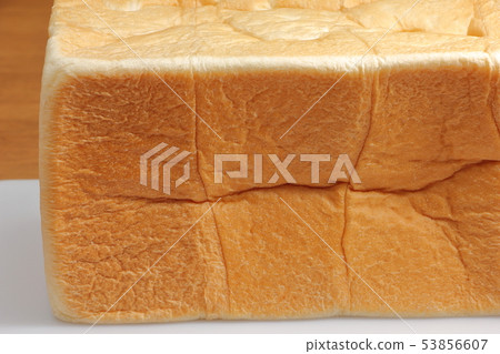 Square shaped bread before cutting. 53856607