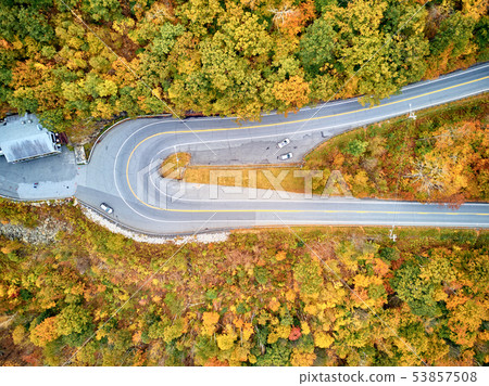 Scenic highway hairpin turn in autumn 53857508