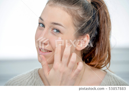 portrait of beautiful young woman with long hair 53857883