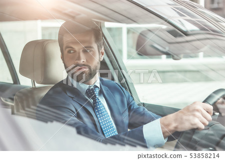 Always in style. Portrait of stylish and successful young bearded businessman in formal wear is Always in style. Portrait of stylish and successful young bearded businessman in formal wear is 53858214