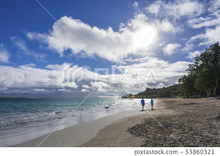 Kailua beach sunrise and couple walk 53860321