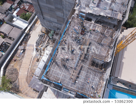 Aerial view of busy industrial construction site 53862300