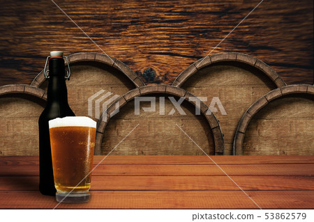 Wooden barrel background and glass of beer on a 53862579