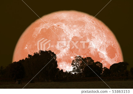 full Thunder moon on night sky back over full Thunder moon on night sky back over 53863153