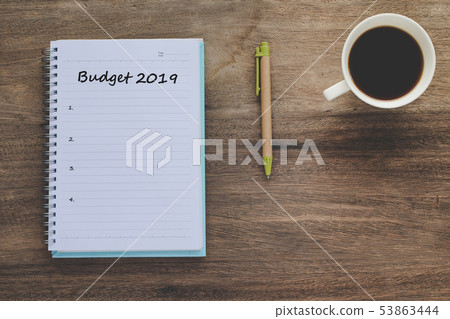 Budget 2019 Plan text on book note with cup of Budget 2019 Plan text on book note with cup of 53863444