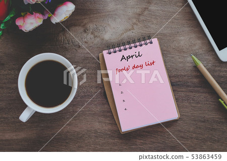 April fools' day text list on book note with cup April fools' day text list on book note with cup 53863459