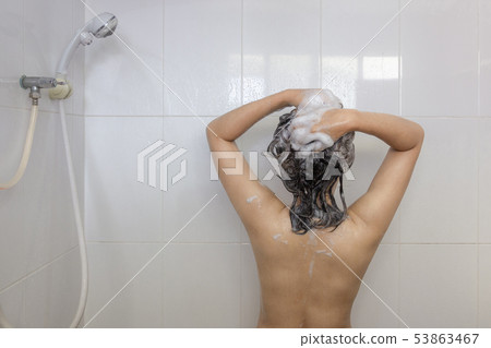 Young asian woman taking a shower and washing hair 53863467